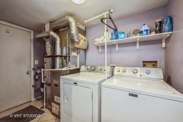 285 Sheffield Dr, Schaumburg, IL 60194 - washroom featuring washer and dryer and light tile patterned floors