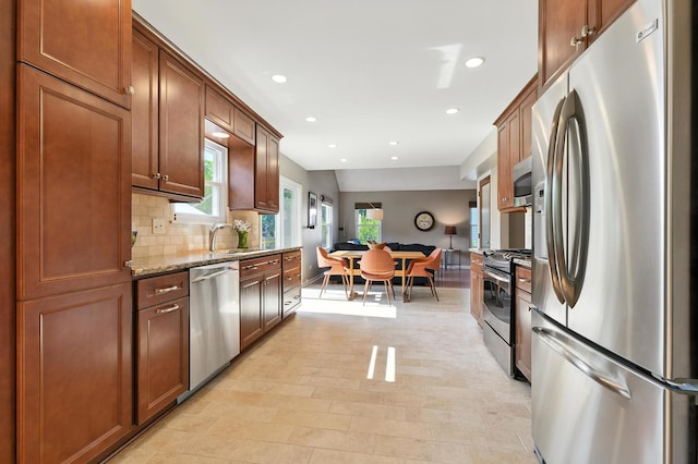920 Matthew Ct, Naperville, IL 60540 - kitchen featuring stainless steel appliances, recessed lighting, light stone countertops, decorative backsplash, and brown cabinets