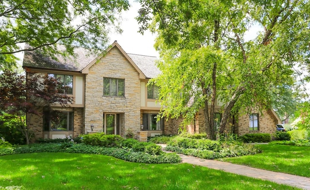 560 81st St, Burr Ridge, IL 60527 - english style home featuring stone siding, a front yard, and a high end roof