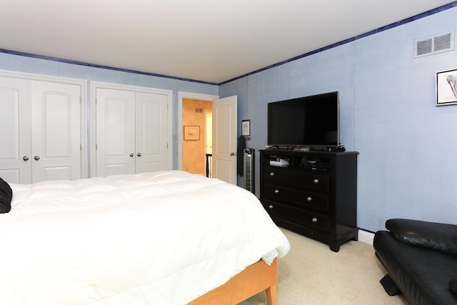 560 81st St, Burr Ridge, IL 60527 - bedroom featuring light carpet and two closets