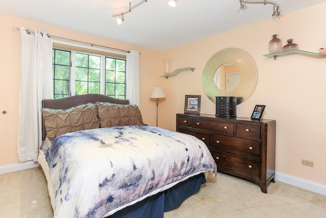 560 81st St, Burr Ridge, IL 60527 - carpeted bedroom featuring baseboards and rail lighting