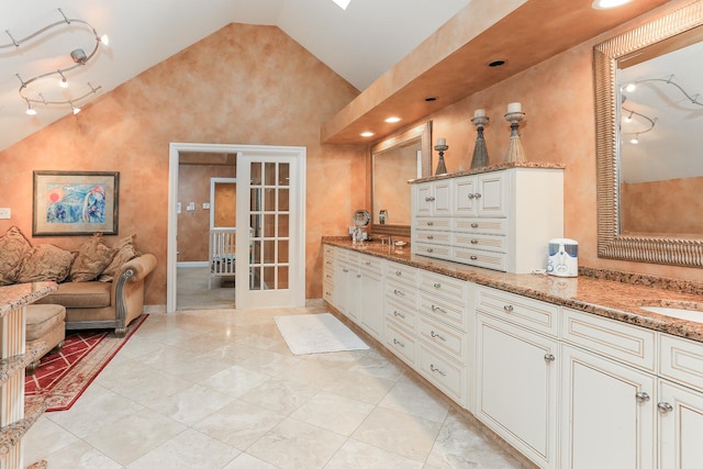 560 81st St, Burr Ridge, IL 60527 - full bathroom featuring french doors, double vanity, and high vaulted ceiling