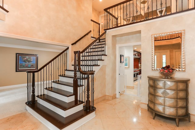 560 81st St, Burr Ridge, IL 60527 - stairway featuring a towering ceiling and baseboards