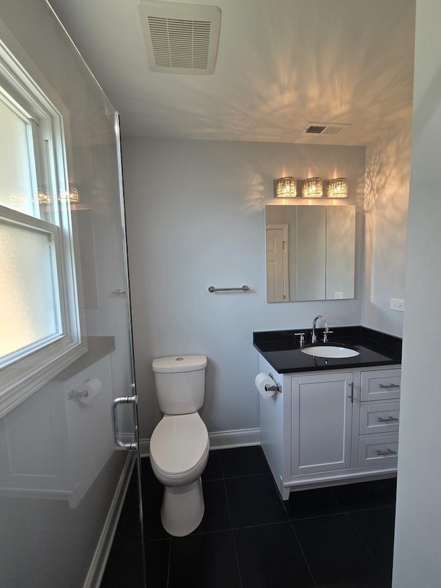 1807 W Locust Ln, Mount Prospect, IL 60056 - full bath with vanity, tile patterned floors, and a shower with shower door