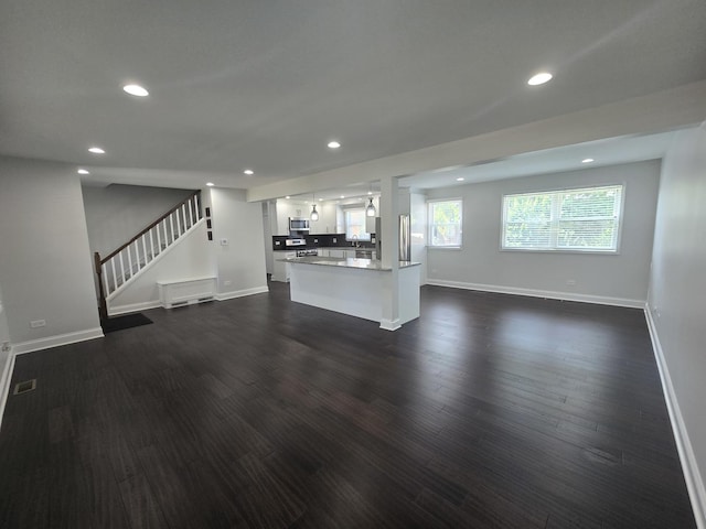 1807 W Locust Ln, Mount Prospect, IL 60056 - unfurnished living room with recessed lighting, dark wood finished floors, and stairway