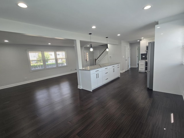 1807 W Locust Ln, Mount Prospect, IL 60056 - kitchen with white cabinetry, dark wood-style floors, recessed lighting, pendant lighting, and light stone countertops