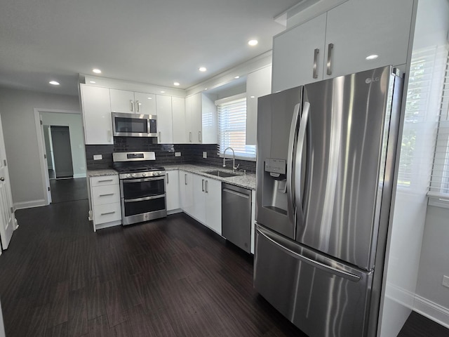1807 W Locust Ln, Mount Prospect, IL 60056 - kitchen featuring stainless steel appliances, light stone countertops, white cabinets, tasteful backsplash, and dark wood-style flooring