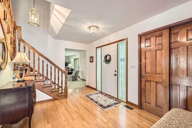 3825 Charlemagne Dr, Hoffman Estates, IL 60192 - foyer entrance featuring light wood finished floors and stairs