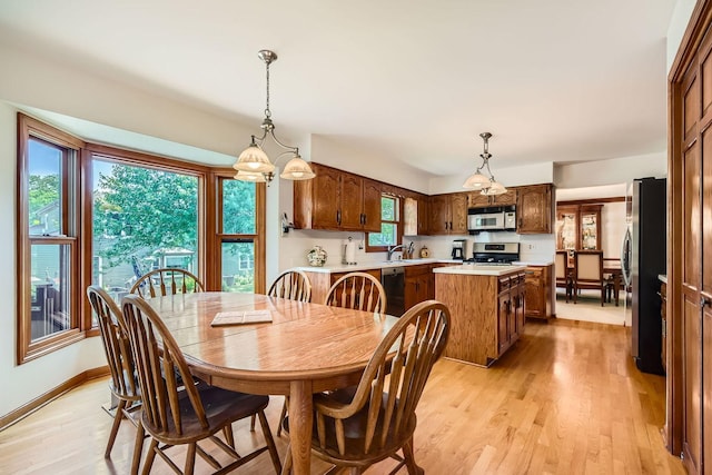 3825 Charlemagne Dr, Hoffman Estates, IL 60192 - dining area featuring light wood-style flooring and baseboards