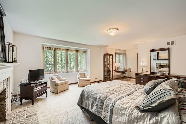 3825 Charlemagne Dr, Hoffman Estates, IL 60192 - bedroom featuring a fireplace, multiple windows, and light carpet
