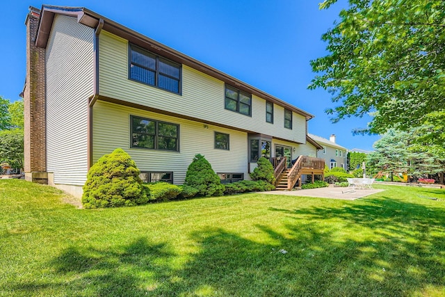3825 Charlemagne Dr, Hoffman Estates, IL 60192 - rear view of house featuring a patio, a deck, stairway, a yard, and a chimney