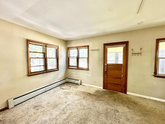 673 Parkway Ave, Elgin, IL 60120 - entryway with a baseboard heating unit and carpet floors