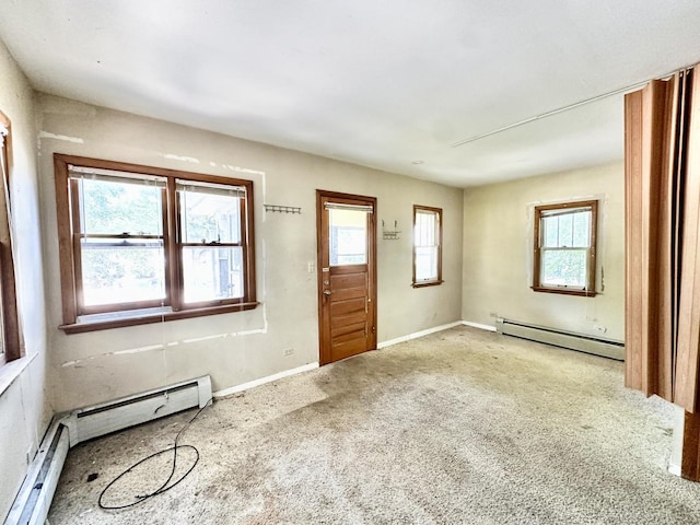 673 Parkway Ave, Elgin, IL 60120 - entrance foyer featuring a baseboard radiator, plenty of natural light, and carpet