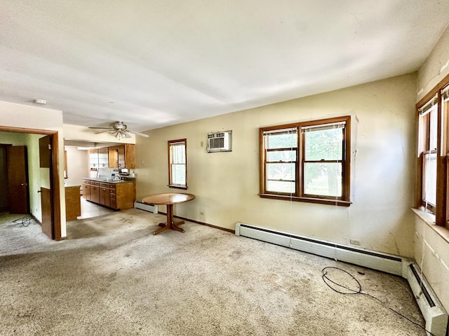 673 Parkway Ave, Elgin, IL 60120 - unfurnished living room featuring a baseboard radiator, a ceiling fan, and a wall mounted air conditioner
