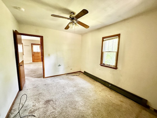 673 Parkway Ave, Elgin, IL 60120 - empty room featuring carpet flooring, a ceiling fan, and baseboard heating