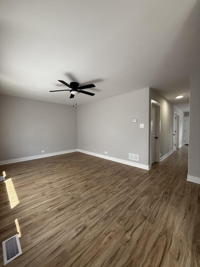 1400 W 73rd Pl, Chicago, IL 60636 - spare room featuring a ceiling fan and dark wood-style floors