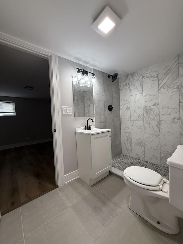 1400 W 73rd Pl, Chicago, IL 60636 - bathroom with a tile shower, vanity, and tile patterned flooring