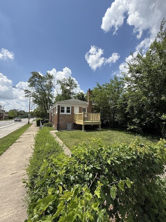 1400 W 73rd Pl, Chicago, IL 60636 - rear view of house featuring brick siding, a deck, and a chimney