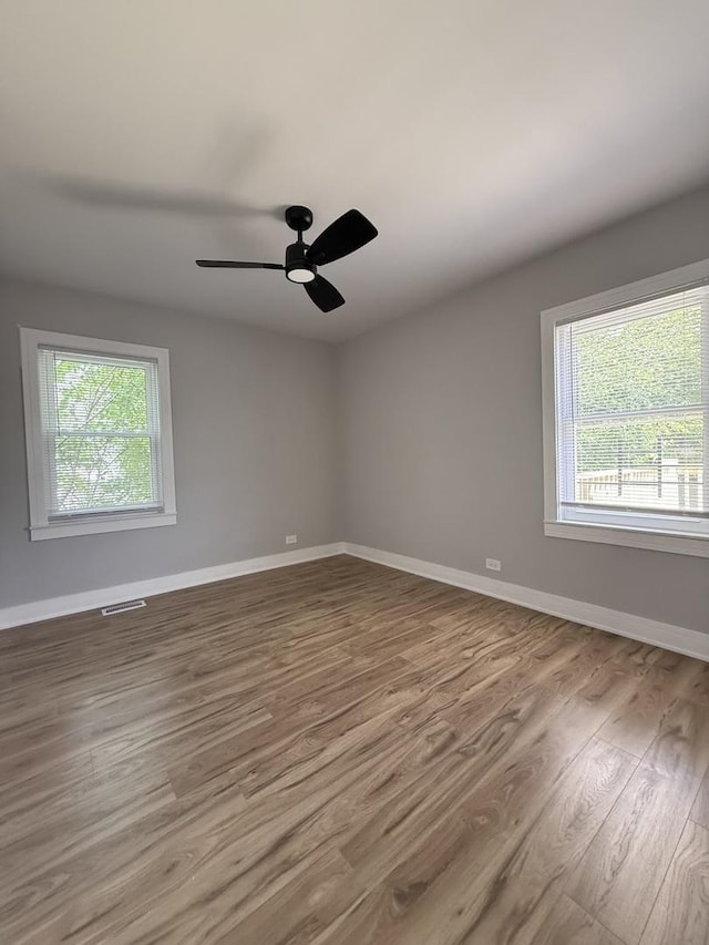 1400 W 73rd Pl, Chicago, IL 60636 - spare room featuring wood finished floors and a ceiling fan
