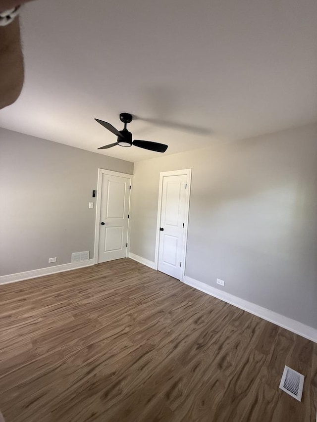 1400 W 73rd Pl, Chicago, IL 60636 - spare room featuring dark wood finished floors and a ceiling fan