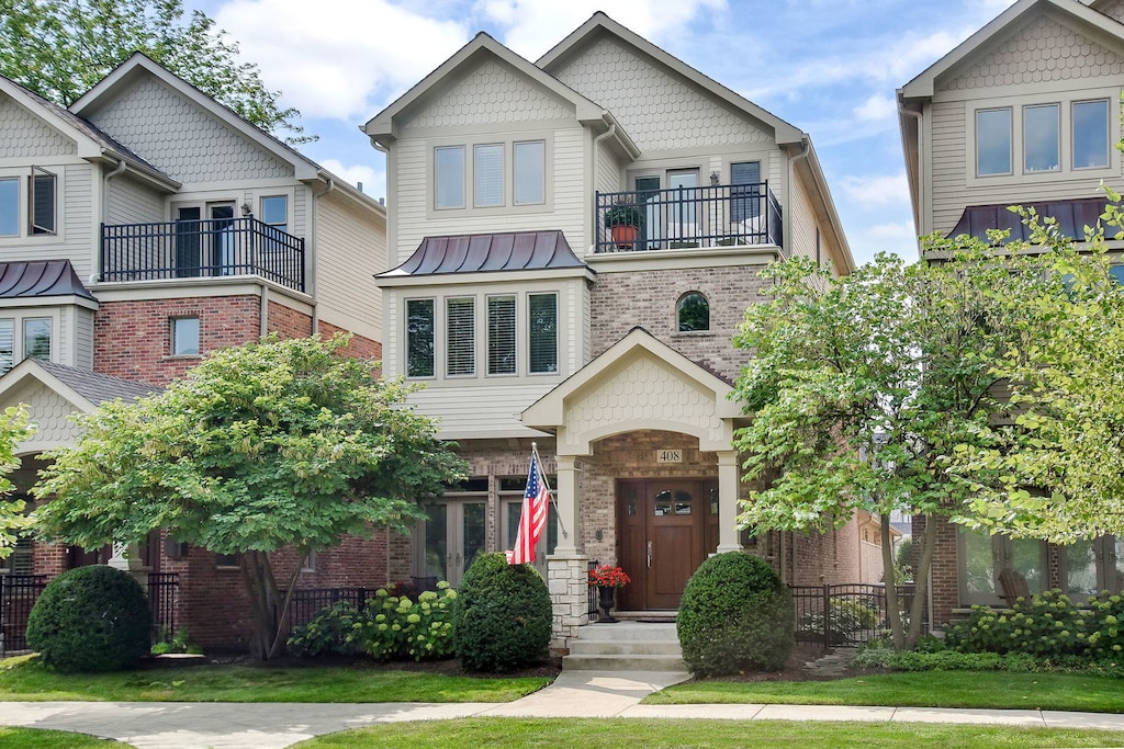 408 W Seminary Ave, Wheaton, IL 60187 - victorian home featuring a balcony and brick siding