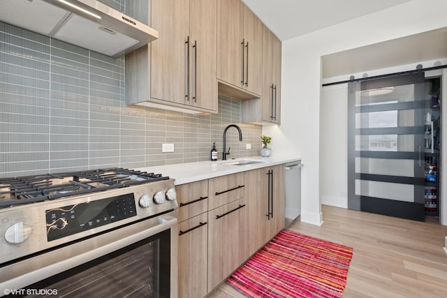 1261 N Paulina Ave Unit 6, Chicago, IL 60622 - kitchen featuring stainless steel appliances, extractor fan, wine cooler, backsplash, and a barn door