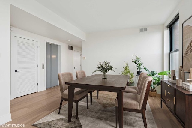 1261 N Paulina Ave Unit 6, Chicago, IL 60622 - dining area featuring wood finished floors and elevator