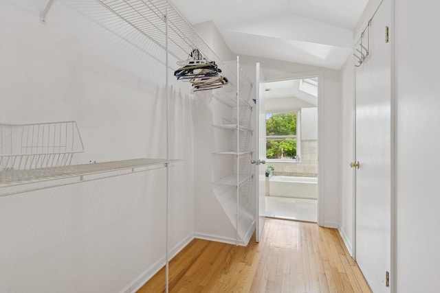 1006 Foster St, Evanston, IL 60201 - spacious closet featuring vaulted ceiling and light wood finished floors