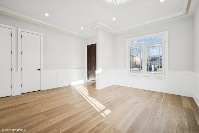 124 Lincoln St, Glenview, IL 60025 - unfurnished room featuring light wood-style floors, wainscoting, a decorative wall, and recessed lighting
