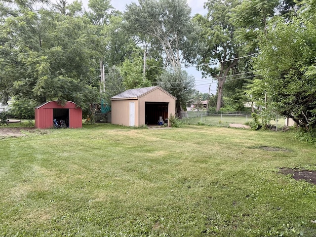 261 S Edison Ave, Elgin, IL 60123 - view of yard featuring a detached garage and a shed