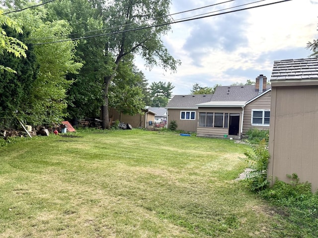 261 S Edison Ave, Elgin, IL 60123 - view of green lawn featuring a sunroom