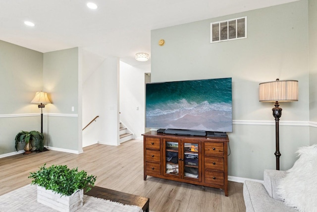 515 Declaration Ln Unit 1401, Aurora, IL 60502 - living area with wood finished floors, recessed lighting, and stairway