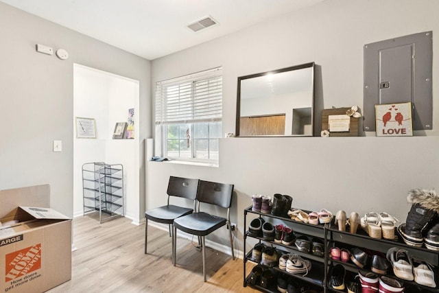 515 Declaration Ln Unit 1401, Aurora, IL 60502 - sitting room with electric panel and wood finished floors