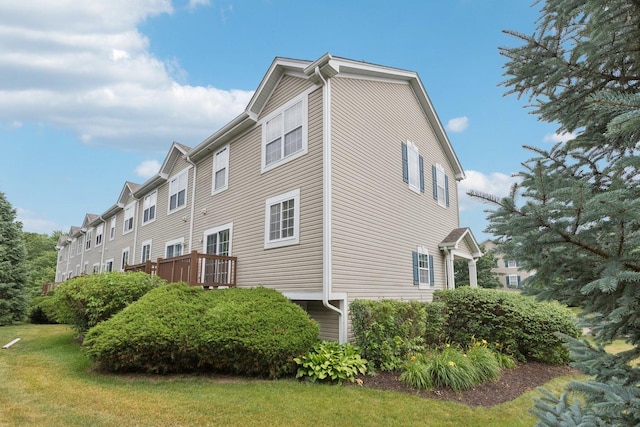 515 Declaration Ln Unit 1401, Aurora, IL 60502 - view of home's exterior with a lawn