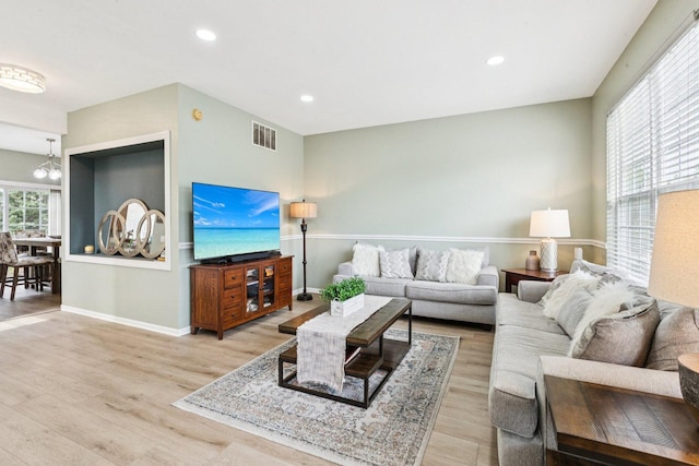 515 Declaration Ln Unit 1401, Aurora, IL 60502 - living room with wood finished floors, a chandelier, and recessed lighting