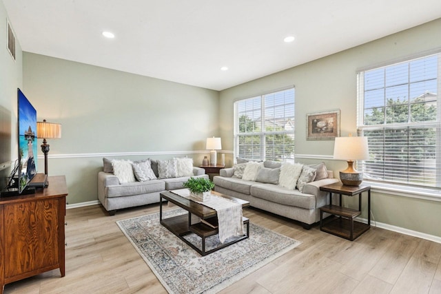 515 Declaration Ln Unit 1401, Aurora, IL 60502 - living room featuring light wood-style flooring and recessed lighting