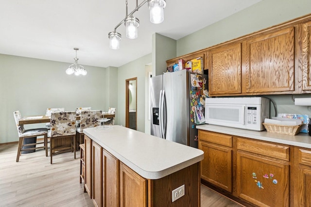 515 Declaration Ln Unit 1401, Aurora, IL 60502 - kitchen with white microwave, stainless steel refrigerator with ice dispenser, and brown cabinets