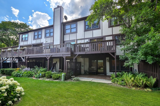 74 White Oak Cir, Saint Charles, IL 60174 - rear view of house featuring a yard, a chimney, and stucco siding