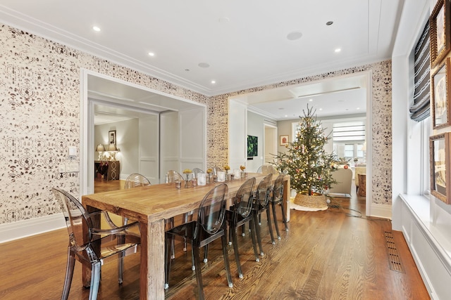 159 E Walton Pl Unit 5C, Chicago, IL 60611 - dining space with wallpapered walls, crown molding, wood finished floors, and recessed lighting