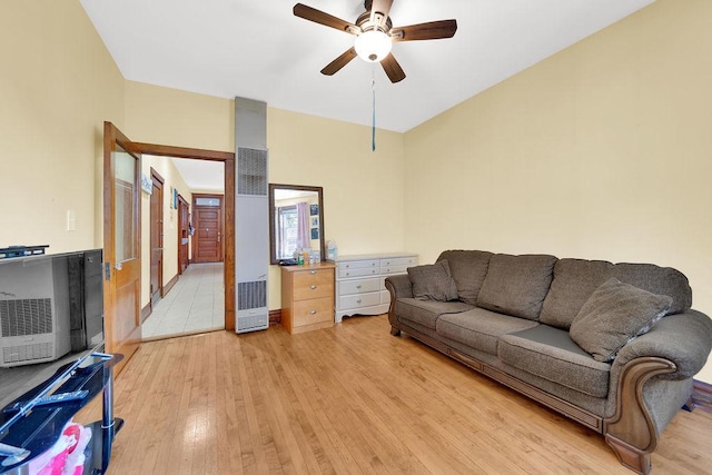 3209 S Harding Ave, Chicago, IL 60623 - living area featuring a heating unit, ceiling fan, and light wood finished floors