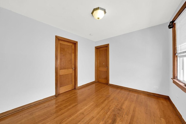 3209 S Harding Ave, Chicago, IL 60623 - empty room featuring baseboards and light wood-style floors