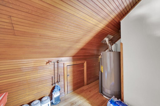 3209 S Harding Ave, Chicago, IL 60623 - additional living space featuring gas water heater, lofted ceiling, wood ceiling, wooden walls, and wood finished floors