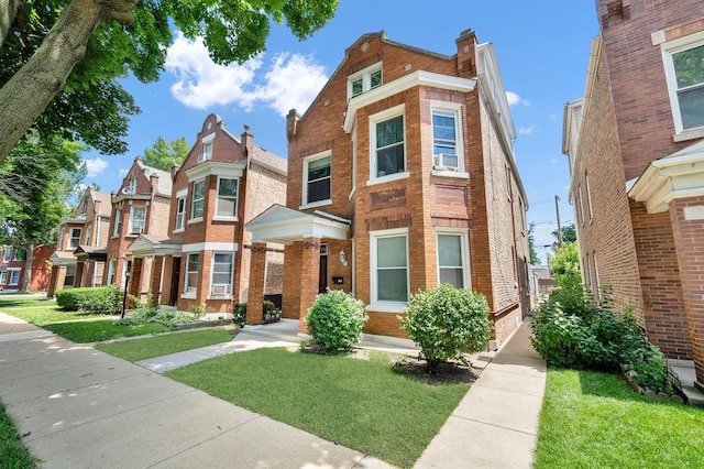 3209 S Harding Ave, Chicago, IL 60623 - view of front of property with brick siding and a front yard