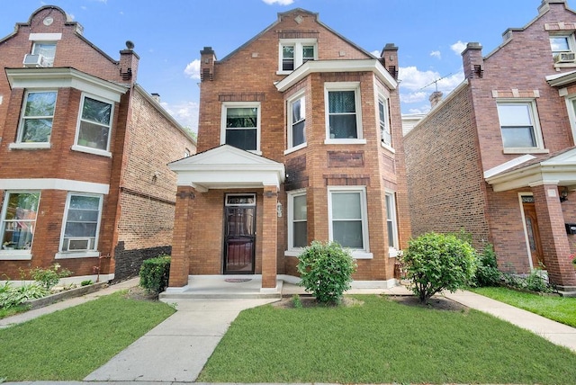 3209 S Harding Ave, Chicago, IL 60623 - view of front of home featuring brick siding and a front yard
