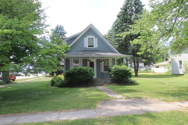 9701 Illinois St, Hebron, IL 60034 - bungalow-style home featuring covered porch and a front yard