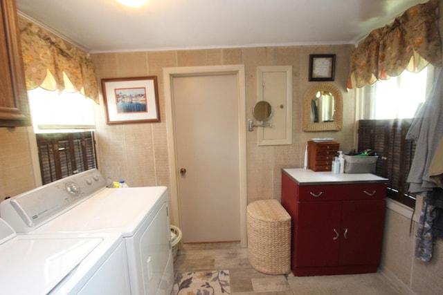 9701 Illinois St, Hebron, IL 60034 - laundry area featuring washing machine and clothes dryer, plenty of natural light, and ornamental molding