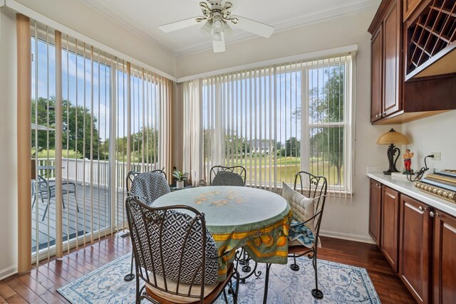 12663 Cold Springs Dr, Huntley, IL 60142 - dining space featuring ceiling fan, dark wood-style floors, and crown molding