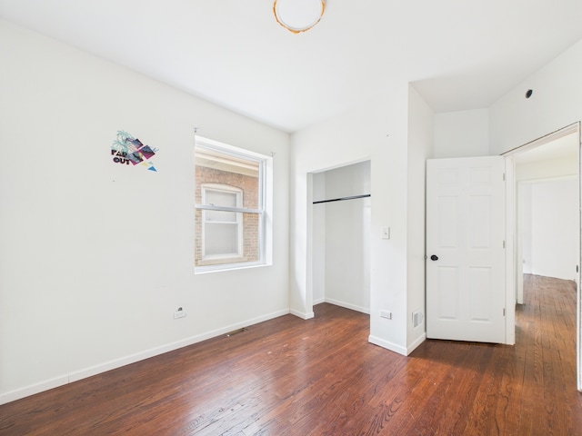 8015 S Paxton Ave, Chicago, IL 60617 - unfurnished bedroom with wood finished floors and a closet