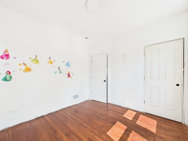 8015 S Paxton Ave, Chicago, IL 60617 - spare room featuring wood finished floors