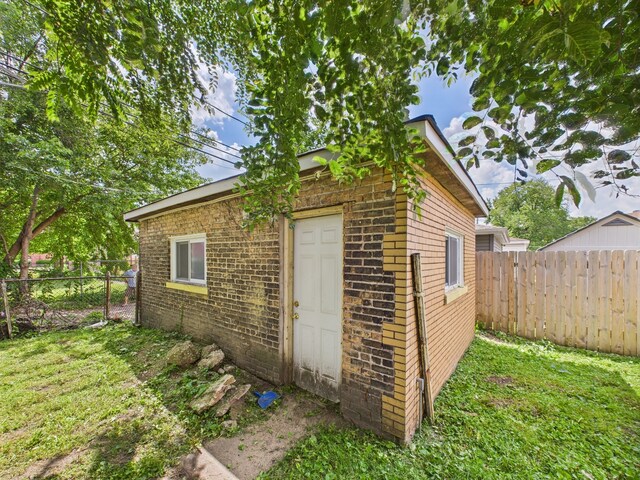 8015 S Paxton Ave, Chicago, IL 60617 - view of outdoor structure featuring a fenced backyard